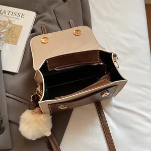 Retro canvas and brown leather crossbody bag with magnetic closure and plush pendant