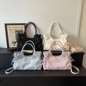 Retro aesthetic shoulder bags in black, beige, blue and pink with adjustable straps