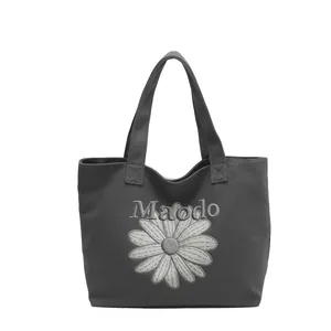 Retro canvas tote bag with daisy embroidery and Maodo lettering in dark grey finish