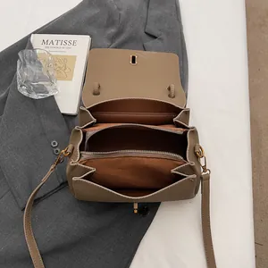 Khaki leather crossbody bag with three internal compartments and vintage gold hardware