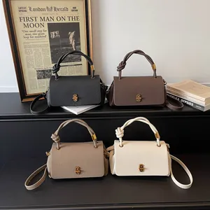 Fashionable retro leather crossbody handbag with knotted handle and T-lock clasp