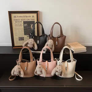 Litchi texture leather bucket bags in five colors with cute rabbit pendants