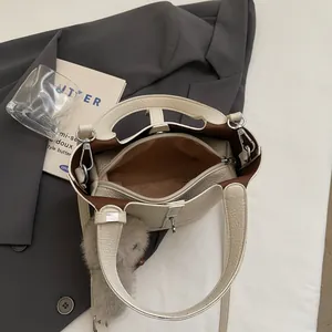 Chic beige lychee grain leather bucket bag with top handles and inner zipper pouch