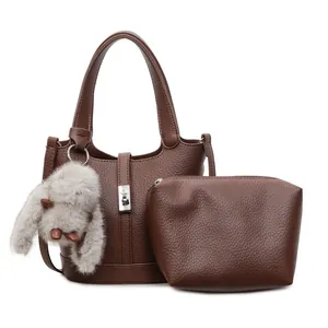 Brown litchi grain bucket bag set with silver clasp and plush bunny keychain charm