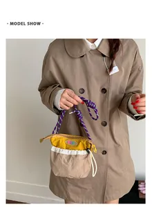 Outdoor leisure crossbody bag with color blocking details and woven rope strap