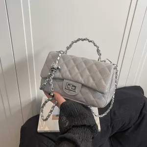 Quilted grey chain crossbody bag with silver metal ball adjuster and hardware