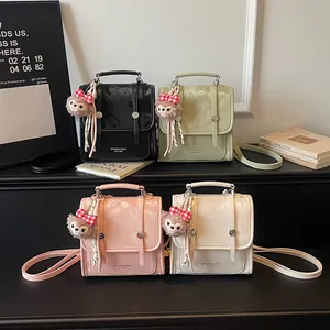 Chic multi-color PU leather crossbody bags with bear charms and adjustable shoulder straps