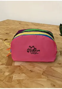 Detailed view of large capacity rainbow nylon toiletry bag with colorful zip layers