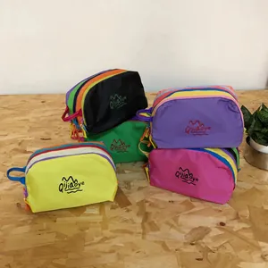 Colorful nylon travel toiletry bags with mountain logo in multiple vibrant shades