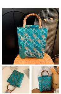 Close-up of retro jacquard fabric with fish scale patterns and natural bamboo handles
