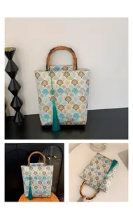 Detail of jacquard tote bag featuring wave patterns, bamboo handle, and green tassel
