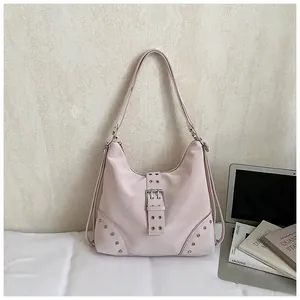 Light pink Y2K shoulder bag with silver rivets and metallic buckle details for women