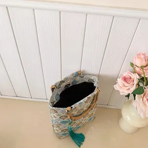 Vintage jacquard handbag with bamboo handle, fan pattern fabric and blue tassel detail