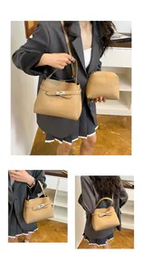 Close-up of khaki pebbled leather bucket bag set with silver hardware locks and straps
