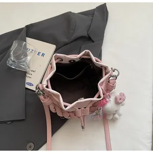 Top view of pink woven bucket bag with drawstring closure and interior organizer pockets