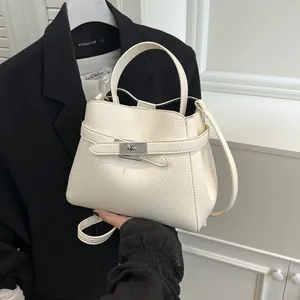Elegant white lychee pattern leather bucket handbag with silver twist lock and strap