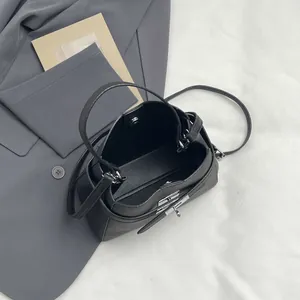 Classic black litchi pattern bucket bag with silver hardware and top handle strap