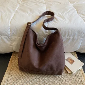 Large dark brown suede tote bag with adjustable strap for daily commute and travel