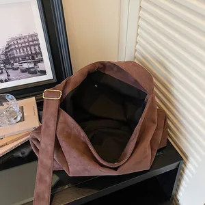 Brown suede tote bag with wide strap and large capacity for casual fashion wear