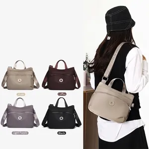Large capacity nylon shoulder bag for women with adjustable strap in four colors