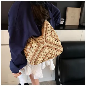 Detail of bohemian granny square crochet tote bag with geometric beige and brown patterns