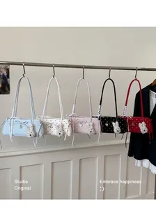 Five chic polka dot shoulder bags in multiple colors with heart and puppy charms