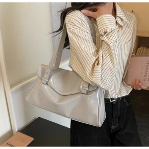 Glossy light gray patent leather tote bag shown on model for daily commuting style