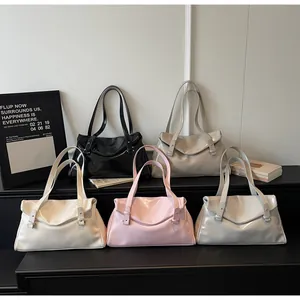Detail showing five glossy minimalist tote bags in black, beige, cream, pink, and light blue