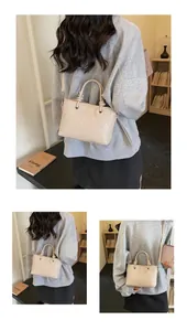 Dettagli della trama intrecciata beige e finiture argentate su una borsa a tracolla