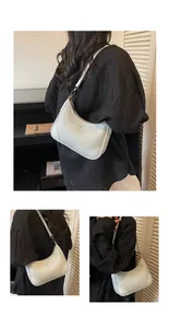 Detailed views of the white lychee grain leather hobo bag with gold logo lettering