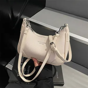 Chic beige lychee leather hobo shoulder bag with silver hardware for daily commute