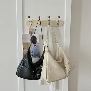 Minimalist large capacity hobo bags in black and beige with metallic rivet details