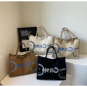 Canvas tote bags in white, khaki, brown, and black with 'Hello!' graphic and smiley face