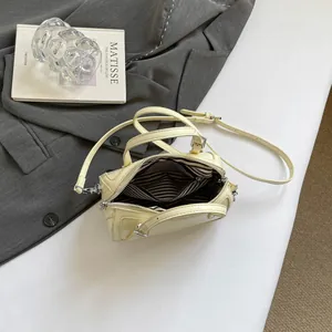 Chic beige leather Boston bag for women, stylish crossbody with striped interior lining