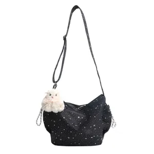 Stylish black star print tote bag with adjustable shoulder strap and cute rabbit pendant