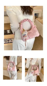 Pink plaid dumpling bag with gold chain and Hello Kitty plush charm detail
