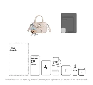 Internal capacity of mini handbag showing space for phone, umbrella and accessories
