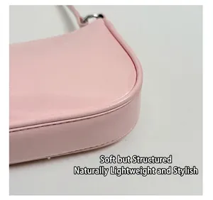 Detailed close-up showing fine stitching and smooth leather texture of the pink bag