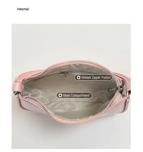 Detail shot of pink handbag interior showing V-weave lining and zipper pocket