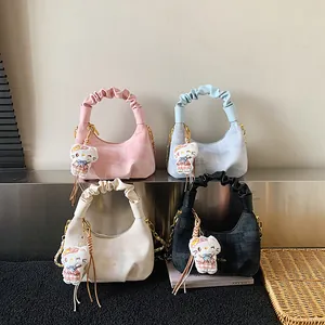 Quilted dumpling bag with ruffle handle and kitty charm in various trendy pastel colors