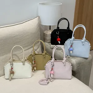 Minimalist wave-shaped shoulder bag in multiple colors with cute mushroom pendant accessory