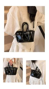 Detail shots of a shiny black bucket bag with silver buckle and detachable shoulder strap