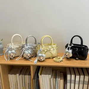 Chic mini handbags in four colors featuring glossy finish and cute bear charms