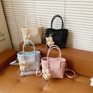 Stylish 2026 spring woven shoulder bags in four colors with cute teddy bear charms