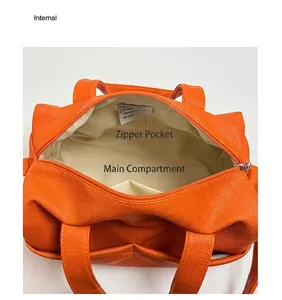 Internal view of the orange lychee leather tote bag showing spacious main pocket and zipped pocket