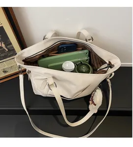 Top view showing spacious interior with brown striped lining of this white tote bag