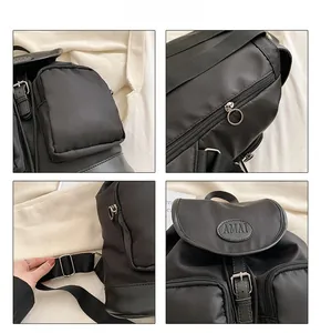Detailed views of black Oxford backpack featuring flap closure and metal buckle hardware