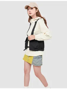 Detail of black tactical vest bag with functional pockets and adjustable buckles