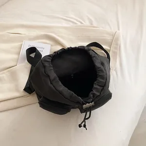 Minimalist black oxford fabric backpack with drawstring closure and large capacity storage