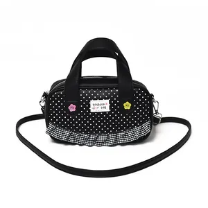 Polka dot crossbody bag for girls with lace ruffles and floral buttons decor